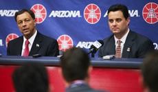 Arizona athletics director Jim Livengood, left, and mens basketball head coach Sean Miller, right, address the media during a news conference on Tuesday in McKale Center. Miller will be the highest paid UA employee in the schools history.