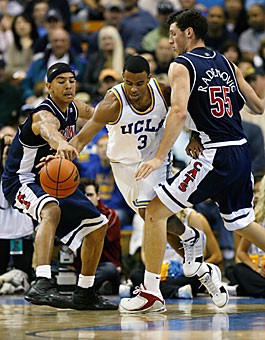 Arizona forwards Marcus Williams (3) and Ivan Radenovic (55) try to defend UCLA guard Josh Shipp during the second half of No. 11 Arizonas 73-69 loss at No. 3 UCLA Saturday at Pauley Pavilion. Williams and Radenovic combined to play all but one minute in part due to the Wildcats lack of depth with forward Bret Brielmaier injured.