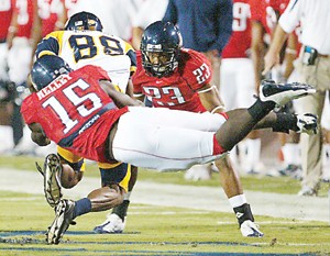 UA linebacker Xavier Kelley (15) latches onto Toledo receiver Stephen Williams in a 41-16 Wildcat win on Sept. 6 at Arizona Stadium. Coaches said Kelley and Sterling Lewis, who now leads the team in tackles after taking over, both play like staring linebackers.