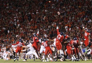 UA defenders attempt to block a last-second field goal during a 19-17 Oregon State win Saturday night at Arizona Stadium. Beaver kicker Justin Kahut missed an extra point attempt minutes earlier, but nailed the 24-yard game-winning kick as time expired to keep Oregon States Rose Bowl hopes alive.