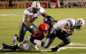 Brigham Young wide receiver Michael Reed cant outrun the grasp of junior safety Dominic Patrick after his 20-yard catch and run in the first quarter of Saturdays16-13 win over BYU at Arizona Stadium. The hard-hitting Patrick made his presence felt with six tackles in his first game at the position formerly manned by the departed Darrell Brooks. 