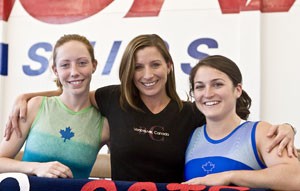 From left, senior Danielle Hicks, assistant coach Colleen Johnson and senior Rachelle Silberg show their Canadian pride during practice in the Mary Roby Gymnastics Training Center yesterday. All three women hail from Canada and have been instrumental to the No. 14 Gymcats success since their arrival.