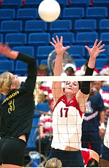 Randy Goodenough attempts a block in Arizonas three-set loss to No. 21 Oregon Friday in McKale Center. Goodenough led the Wildcats with 14 kills and six digs. 