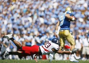 UA linebacker Ronnie Palmer gets his hands on Bruins quarterback Kevin Craft in the Wildcats 31-10 win over UCLA in Pasadena, Calif., Saturday. Craft threw for 81 yards, completing 15 of his 31 throws.