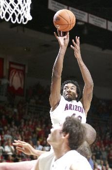 UA forward Jordan Hill goes up for a jump shot in last nights 76-69 win over NAU at McKale Center. Hill fouled out with only eight points in the closest Wildcat margin of victory over NAU since 1986.