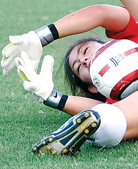 Sophomore goalkeeper Chelsea McIntyre stretches out to corral a save during practice on Aug. 22 at Murphey Field. McIntyre has taken over as the teams starting goalie after starter McCall Smith and backup Devon Wharf were injured.