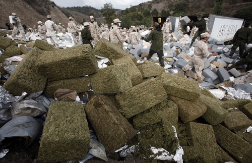 Army troops at the La Tuna Army Base in Tijuana, Mexico, prepare to burn the biggest pot seizure in Mexican history on Wednesday, October 20, 2010. The troops piled the 134 tons of marijuana onto a flat stage, soaked it with diesel fuel and set it aflame. (Mark Boster/Los Angeles Times/MCT)