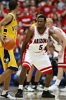 Guard Jawann McClellan crouches in a defensive stance in Arizonas exhibition game against Victoria Nov. 11 in McKale Center. The junior fought through adversity last season but is back to fill a key role on Arizonas perimeter.