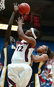 Junior guard Ashley Whisonant tries to loft a shot over Californias Rama Ndiaye, left and Keanna Levy, right, in Arizonas 84-64 loss to the Golden Bears on Saturday in McKale Center. Whisonant and the Wildcats try to snap a six-game losing streak tonight against Washington State in Pullman, Wash.