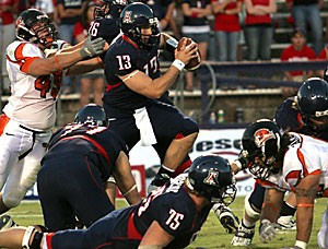 Senior quarterback Kris Heavner scrambles out of the pocket  during Arizonas 17-10 loss to Oregon State Saturday night at Arizona Stadium. Heavner threw for 161 yards but also threw two interceptions and failed to lead the offense to a touchdown.