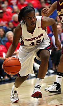Arizonas Joy Hollingsworth drives to the basket during her teams 59-54 loss to ASU Feb. 24 in McKale Center. In her final season as a Wildcat, the senior led Arizona in eight categories, including points per game, 3-pointers and steals.