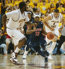 UA guard Nic Wise runs up court during a 70-68 ASU win on Feb. 22 in Tempe. The Wildcats take on the Sun Devils for the third time this season today at noon in the second round of the Pacific 10 Conference Tournament in the Staples Center in Los Angeles.