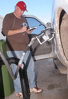 Natural resources professor John Koprowski fills up a university truck at the Facilities Management Motorpool Sept. 21. The motorpool is attempting to switch the majority of its fleet over to an ethanol based fuel, E85.