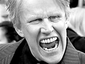We can only assume this is Gary Busey right before he plunged an axe through a door and hollered Heres Johnny!