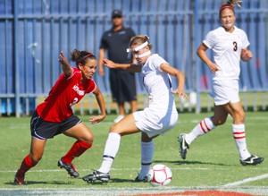 Wildcat utility player Brittany Cole fights for position with a  Cal-State Northridge player in a 2-1 Arizona win at  Murphey Stadium  Sept. 21. The UA will face ASU in Tempe today as the Wildcats open up their Pacific 10 Conference season.