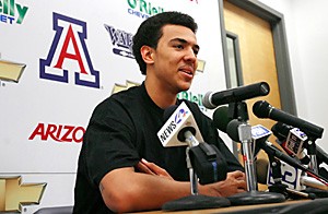 Freshman forward Marcus Williams addresses the media at a press conference yesterday afternoon. Williams announced that he will return to Arizona for his sophomore season. (Photo by Chris Coduto/Arizona Daily Wildcat)