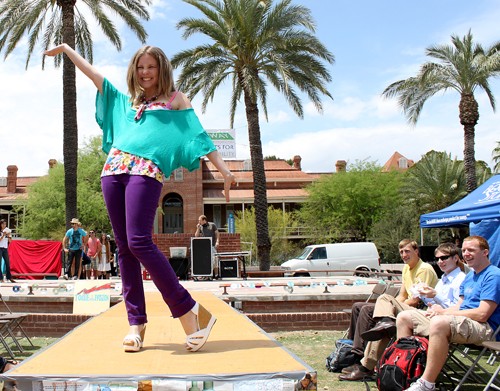 Lisa Beth Earle / Arizona Daily Wildcat 

Meg Peterson, a business management and marketing junior, poses on the catwalk during an environmentally friendly fashion show put on by Students for Sustainability on the UA mall on Monday, April 19. The fashion show was meant to educate the public about sustainability issues.