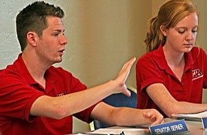 ASUA Senator Steven Gerner a senior majoring in political science, left, who proposed a bylaw change regarding club funding, which passed in January, argues against reversing that decision at the senate meeting yesterday afternoon in the Student Union Memorial Center.