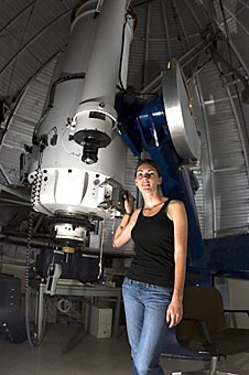 Tricia Wroblewski, a junior majoring in astronomy and physics, runs the telescope at the Steward Observatory on campus. 