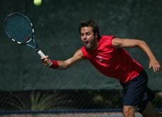 Arizona sophomore Andres Carrasco strains to return the ball during a 4-2 UA win against Stanford on April 3 at Robson Tennis Center. The mens tennis squad will take part in the NCAA Championships starting on Friday.
