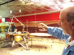 Phoenix team member Rick McCloskey points out some of the features of the Payload Interoperability Testbed (PIT) at the Science Operations Center on Monday. Mission experiments are tested with the equipment at the PIT before being performed on Mars.