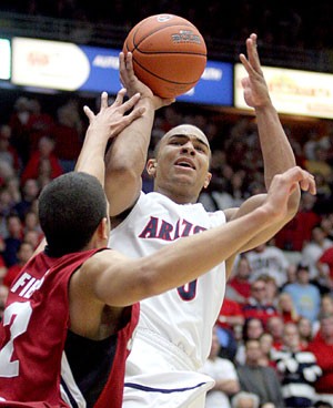 Arizona guard Jerryd Bayless goes up to shoot against Stanford guard Landry Fields in Saturdays 67-66 loss to Stanford in McKale Center. Bayless has scored at least 30 points in his last three games and is averaging more points per game than standout freshmen O.J. Mayo, Kevin Love and Derrick Rose.