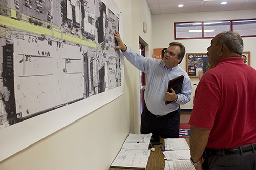 Hallie Bolonkin/ Arizona Daily Wildcat

Mark Novak, a landscape architect with UA planning design and construction, discussed the project plan with Mike Delahanty, senior program coordinate with UA Parking and Transportation Serevices, during the Tyndale Avenue improvement project open house on Thursday. This project will widen the road and add cross walks and bike baths on Tyndale between University and Sixth Street.

