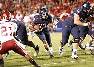 Running back Nicolas Grigsby finds a hole in Arizonas 48-20 win over Washington State Saturday at Arizona Stadium. The freshman Grigsby enjoyed a career day, gaining 262 all-purpose yards, including 186 on the ground.