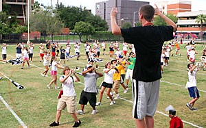 Drum major Bill Patterson conducts the Pride of Arizona as it rehearses its version of Tears for Fears at Bear Down Field on Sept. 5th.