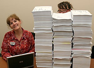 Registrars Office program coordinator Cori Cashen, left, and Document Storage and Retrieval Services employee Kori Camacho demonstrate how the new computerized grading system will eliminate the complicated bubble sheet paper process used last semester.