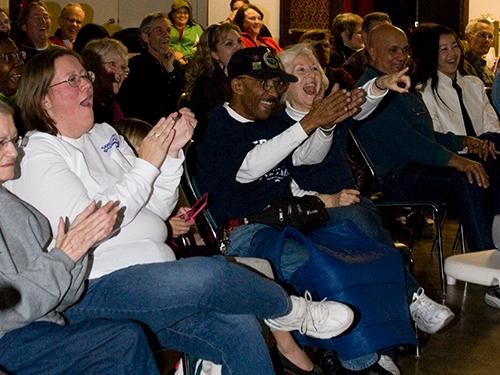 Suzi and Jeffrey Miller (center) applaud as they watch the State of the Union Address on Thursday, January 25, 2011 at the Pima Democratic Headquarters . The couple, married for 16 years, wear their Obama shirts proudly and said that  he has done miracles for the country.  