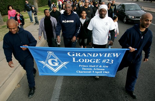 Mike Christy / Arizona Daily Wildcat

Members of the Grandview Masonic Lodge #23 lead the annual Martin Luther King Jr. Day March on Monday to honor the civil rights leader of the 1960s. Marchers held signs and posters honoring Dr. King as they marched from the UA Mall east along Broadway Boulevard to Reid Park.