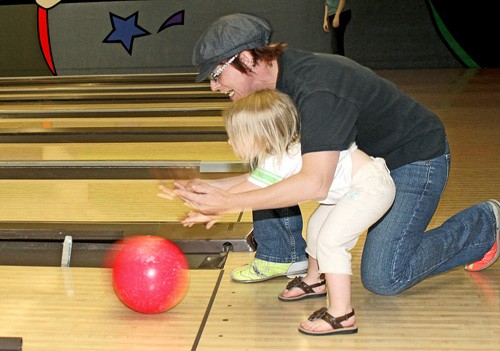 Lisa Beth Earle/ Arizona Daily Wildcat

Heather Moulton, an English literature professor from Central Arizona College, helps two-year-old Jaydin Jackson bowl her best game during the Bowl for a Cure event hosted by the UA College of Pharmacy at Golden Pin Lanes on Saturday, April 4. All proceeds from the event will be donated to the Susan G. Komen for the Cure, an organization which fights breast cancer.