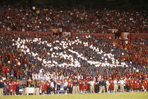 Members of the student section attempt to pull off a card stunt during Saturdays game against Oregon State at Arizona Stadium.