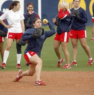 Arizona first baseman Corinna Gonzalez throws during ground ball drills in the Wildcats practice yesterday at Hillenbrand Stadium. The No. 1 Wildcats begin the defense of their back-to-back national titles today when they open up play in the Kajikawa Classic in Tempe against Notre Dame.  