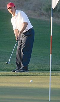 Former UA golfer Henry Liaw putts during the Ping-Arizona Intercollegiate tournament January in Tucson. After three successful seasons as a Wildcat, Liaw chose to forego his senior year to turn pro.