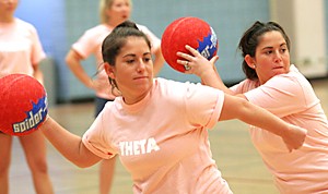 JOSH FIELDS / Arizona Daily Wildcat

Regional Development juniors Tara and Lauren Miller compete in a dodgeball tournament to benefit the Cycstic Fibrosis Foundation.  The tournament was held yesterday afternoon at the student recreation center.  