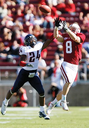 UA cornerback Trevin Wade (24) tries to break up a pass to Stanford wide receiver Ryan Whalen in a 24-23 Cardinal win on Saturday in Palo Alto, Calif. The UA is now tied for third in the Pacific 10 Conference.
