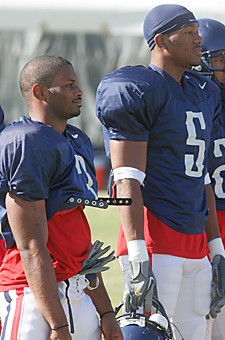 Sophomore cornerbacks Antoine Cason, right, and Wilrey Fontenot look on during spring practice yesterday. The duo has been a staple of the Arizona secondary since they arrived on campus, not missing a single start in the last two years. With senior safety Darrell Brooks gone, the two will have the responsibility of providing leadership along with their on field duties for the Wildcats defense.