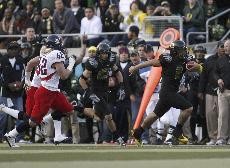  Oregon quarterback Jeremiah Masoli runs down field past the Arizona defense to score on a 66-yard run on the third play from scrimmage. Arizona rallied late, but was unable to overcome a large first half deficit, as the Wildcats fell to Oregon 55-45 at Autzen Stadium on Saturday night.   