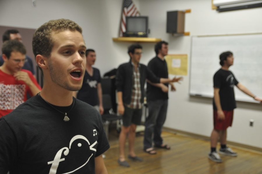 Music Education Junior Ryan Phillips, of the Cat-Call A Cappella group, practices on Sunday night for the Cat-Call and Noterietys Collegiate A Capella Music Concert taking place this coming Saturday.

Alex Kulpinski / Arizona Daily Wildcat

