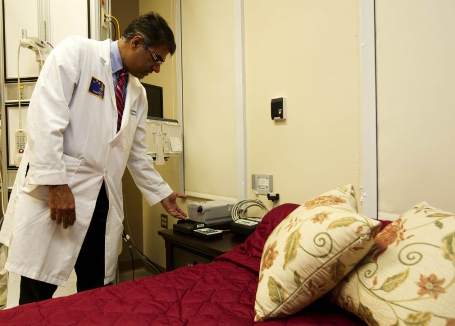 Gordon Bates / Daily Wildcat

Sairam Parthasarathy, an Associate Professor of Medicine and Director of the Center for Sleep Disorders, shows one of the rooms used for in patient sleep studies. During the course of one study session, nurses score 720 to 900 pages of polysomnographic data in the form of graphs, which Dr. Parthasarathy reviews and attempts to diagnose the specific disorder.