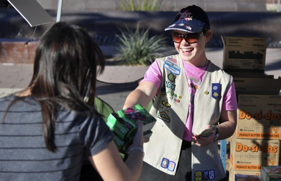 Alex Kulpinski / Arizona Daily Wildcat

Dierdre Dimmick (17) and her mother Cheryl Dimmick run a booth in Alumni Plaza selling Girl Scout cookies. The Girl Scouts are selling cookies on campus for the next five weeks for $4 a box. 