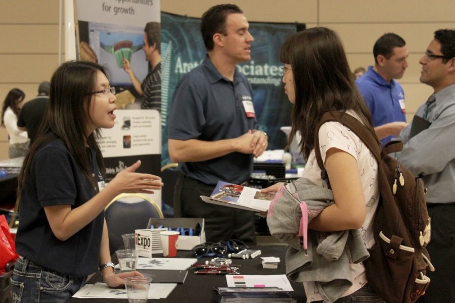 Janice Biancavilla /  Daily Wildcat

Mechanical Engineering Junior Li Jiang speaks with a recruiter in the North Ballroom in the Student Union Memorial center on Tuesday, Feb. 21 during the UA College of Engineering iExpo. The industry career fair featured several organizations that are offering internships and entry level positions for career-seeking students.