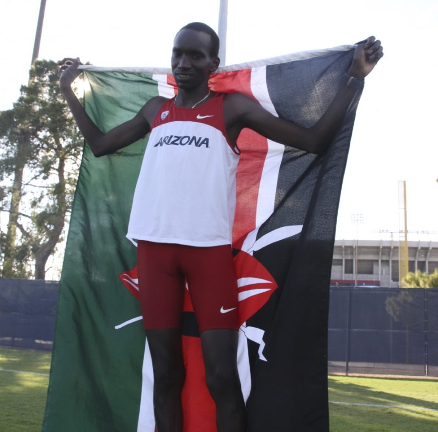 Kevin Brost / Arizona Daily Wildcat

Kenyan cross country athlete and University of Arizona student Lawi Lalang poses with his Kenyan flag on October 25, 2011.

