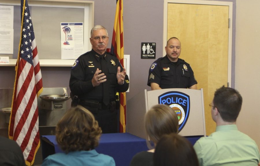 Will Ferguson / Arizona Daily Wildcat

Chief Anthony Dakin and Sgt. Juan Alvarez speak at an award ceremony held by the University of Arizona Police Department for members of the community who have helped officers in the line of duty. The event took place on the UA campus on April 24, 2012. 

