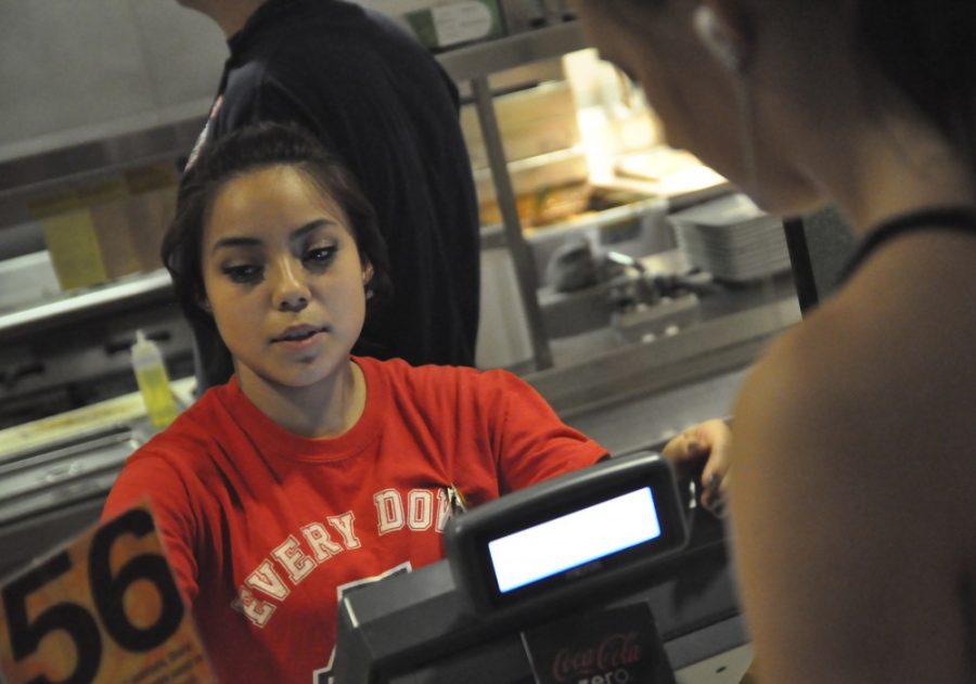 Alex Kulpinski / Arizona Daily Wildcat

Suzette Rodriguez, a Media Arts Freshman, takes orders during the lunch rush at the Cellar Bistro.  Rodriguez has worked in the Cellar since August. 
