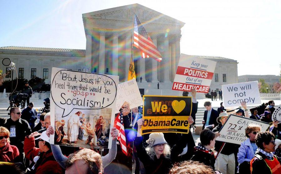 Demonstrators+for+and+against+the+Patient+Protection+and+Affordable+Care+Act+march+and+chant+outside+the+U.S.+Supreme+Court+Building+on+March+27%2C+2012+in+Washington%2C+DC.++The+Supreme+Court+digs+deep+into+health+care+this+morning%2C+as+the+justices+consider+the+most+important+challenge+to+the+law%3A+compelling+individuals+to+buy+insurance+or+pay+a+fine.+%28Olivier+Douliery%2FAbaca+Press%2FMCT%29