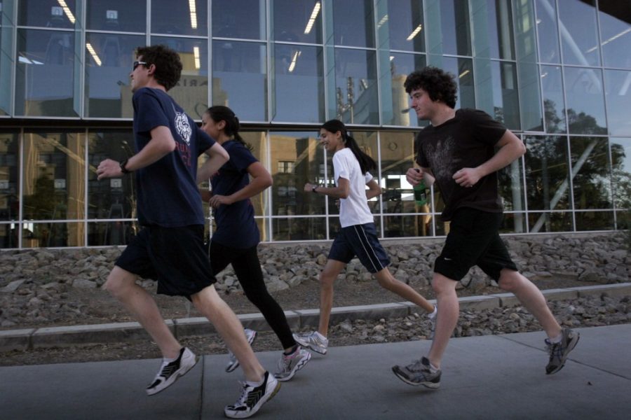 Ernie Somoza/ Arizona Daily Wildcat

Four students run past the Student Recreation Center as they make their way down Sixth Street.