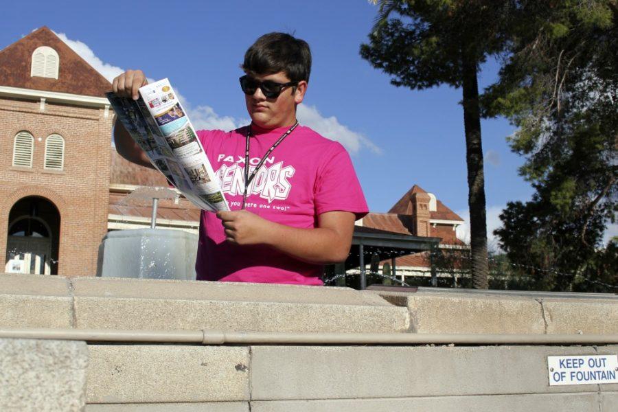 Photo Illustration by KYLE WASSON / Arizona Daily Wildcat

Freshman Josh Franz scans his trusty UA campus map from the friendly waters of Old Mains fountain.

